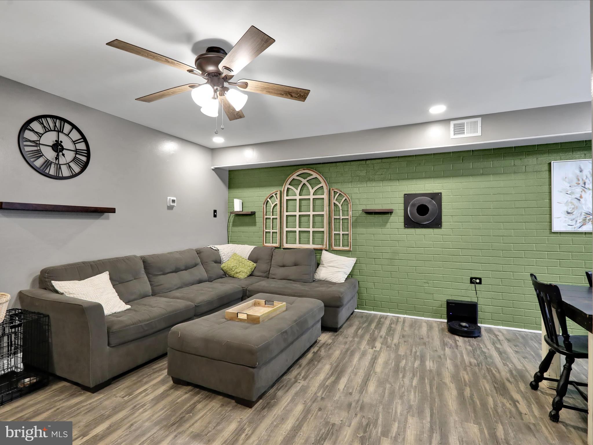 1212 Deer Run Reading, PA 19606 - Photo 4 of 29 a living room with furniture and a wooden floor