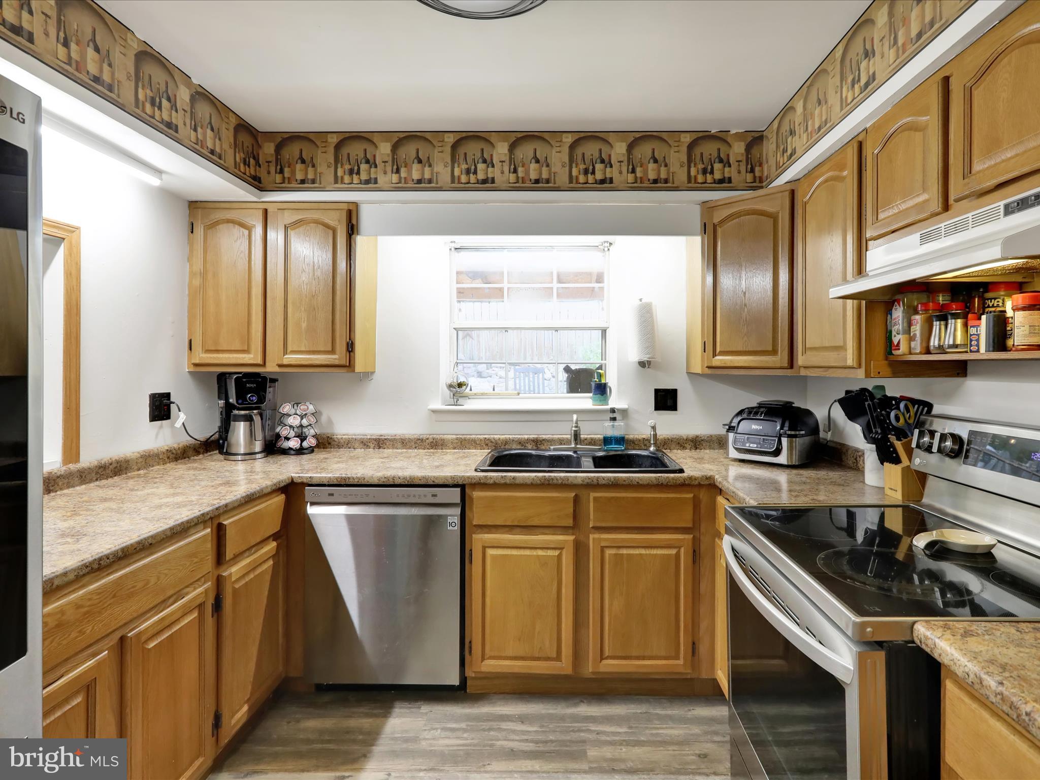 1212 Deer Run Reading, PA 19606 - Photo 9 of 29 a kitchen with stainless steel appliances a sink stove and cabinets