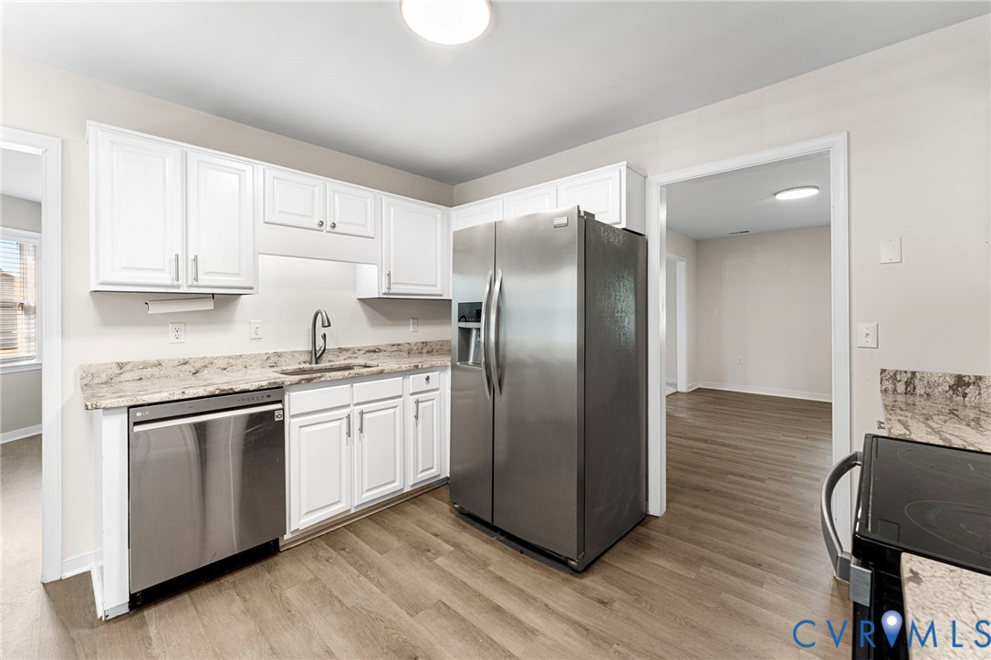 1146 Indian Valley Road Heathsville, VA 22473 - Photo 8 of 45 a kitchen with stainless steel appliances granite countertop a refrigerator a stove and a refrigerator