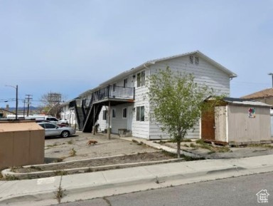 590 Pilot Avenue Wendover, UT 84083 - Photo 2 of 20 View of front of home featuring a storage shed and stairs