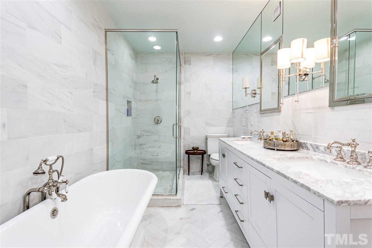1114 Harvey Street Raleigh, NC 27608 - Photo 16 of 24 a bathroom with a double vanity sink mirror and double