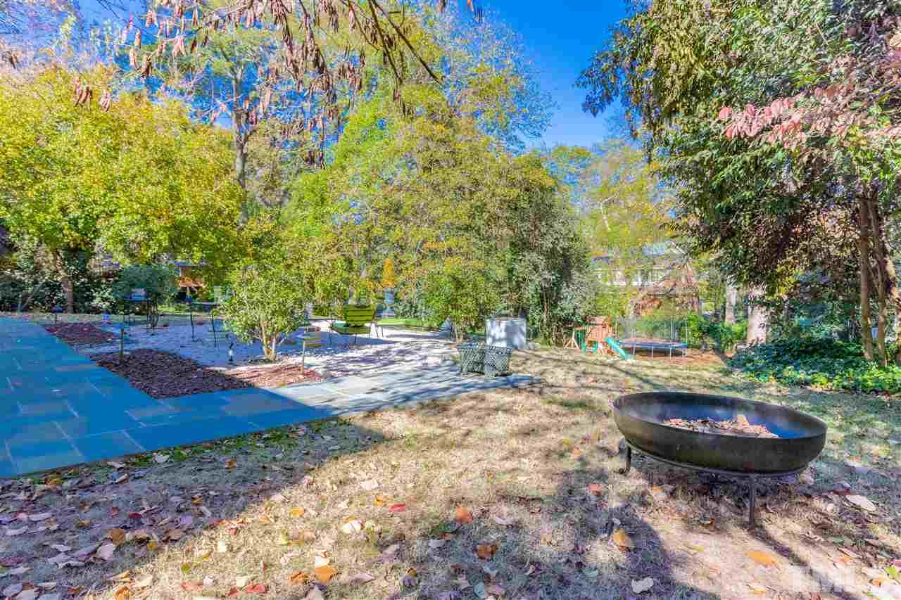 1114 Harvey Street Raleigh, NC 27608 - Photo 23 of 24 a view of a backyard with table and chairs