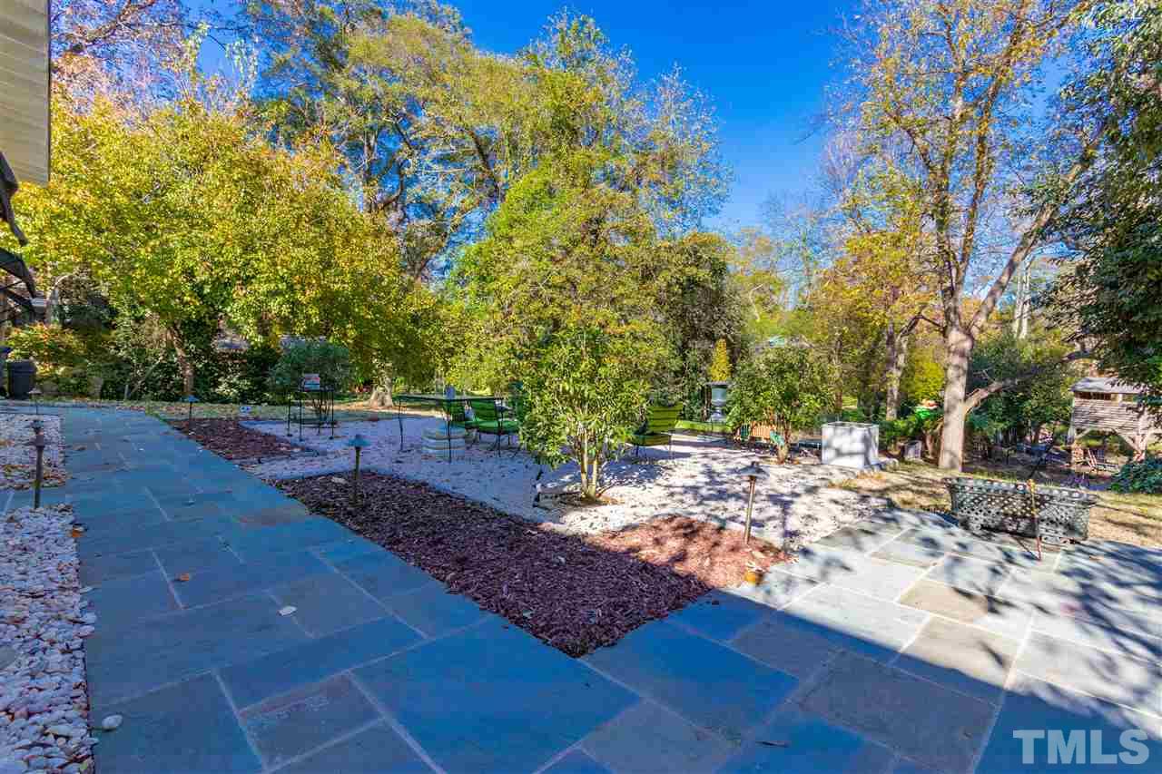 1114 Harvey Street Raleigh, NC 27608 - Photo 24 of 24 a view of a yard with an tree