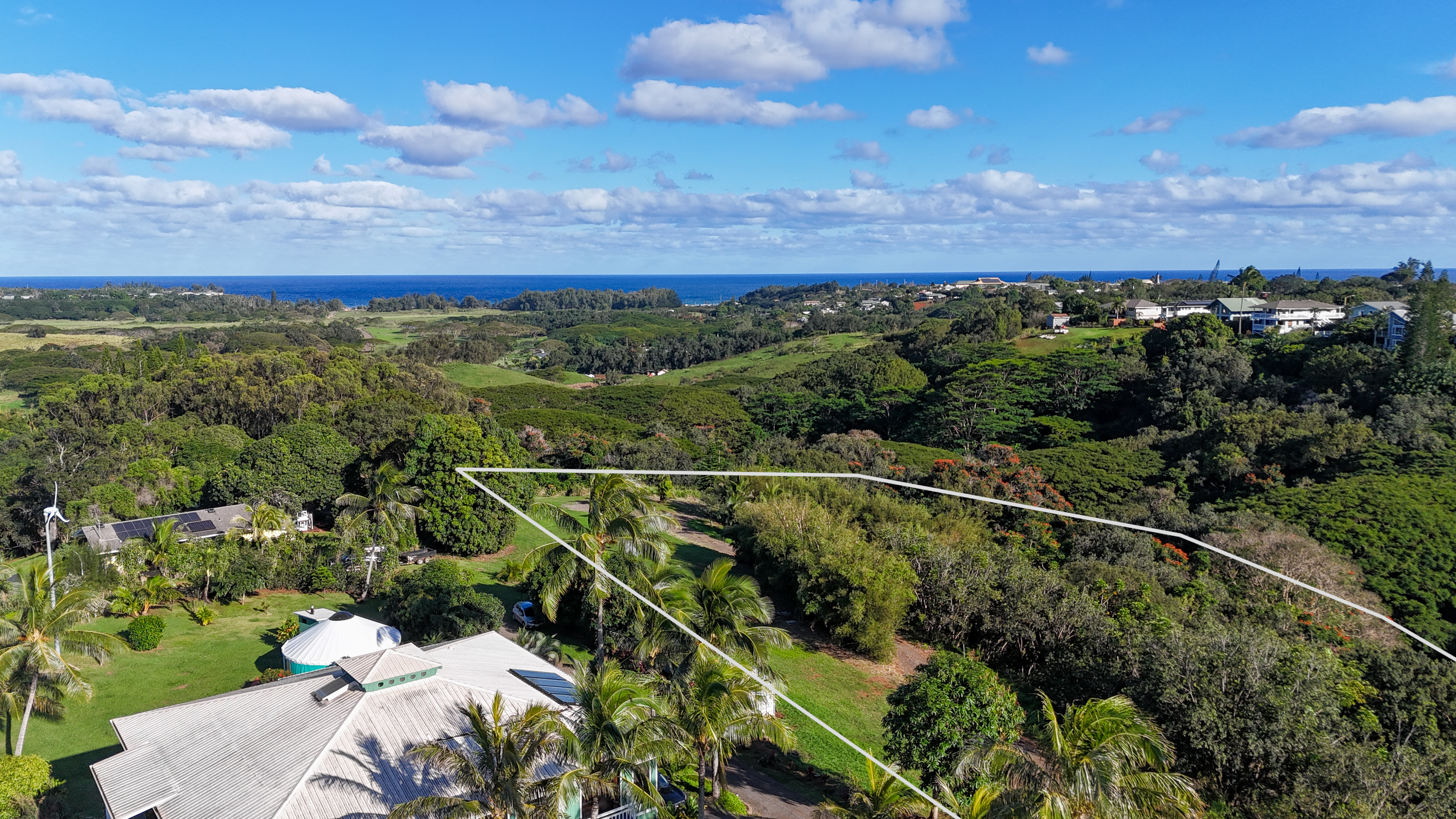 5409 Lot 2 Laipo Road, Unit 2 Kapaa, HI 96746 - Photo 17 of 24 a view of a city with lush green forest