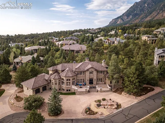 a view of a house with pool garden and patio