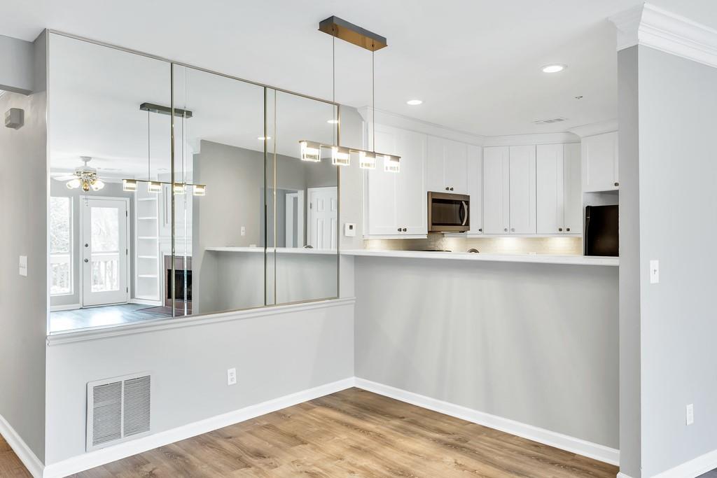 489 Sherman Way Decatur, GA 30033 - Photo 1 of 1 a kitchen with kitchen island a counter top space appliances and cabinets
