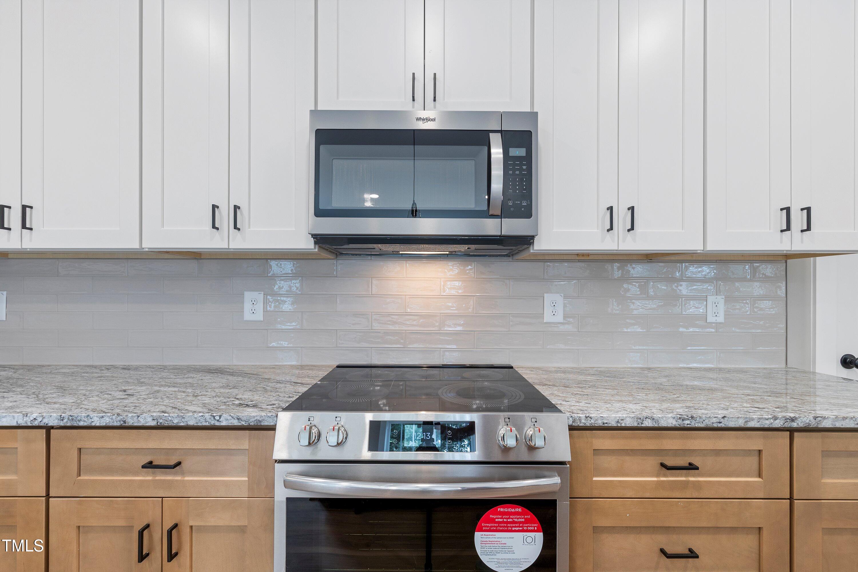 9293 Bear Run Lane Middlesex, NC 27557 - Photo 10 of 36 a stove top oven sitting inside of a kitchen