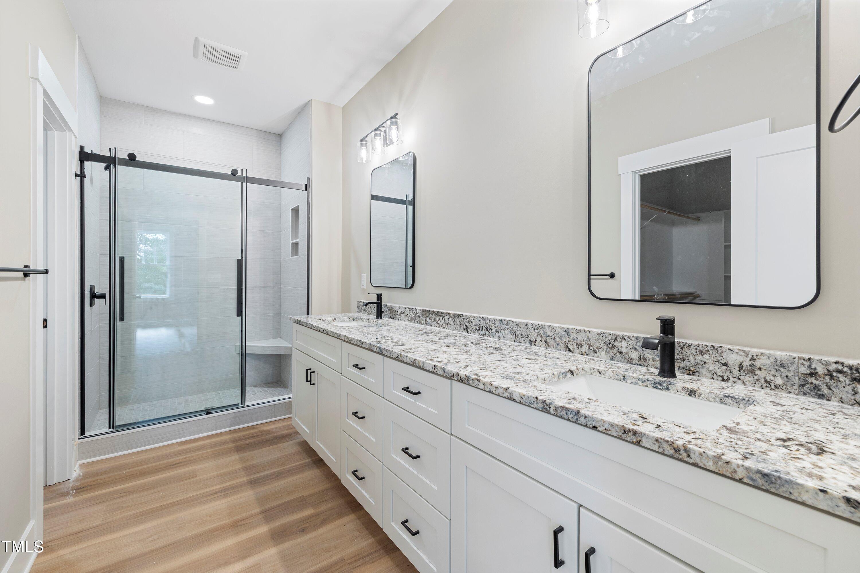 9293 Bear Run Lane Middlesex, NC 27557 - Photo 17 of 36 a bathroom with a double vanity sink mirror and double