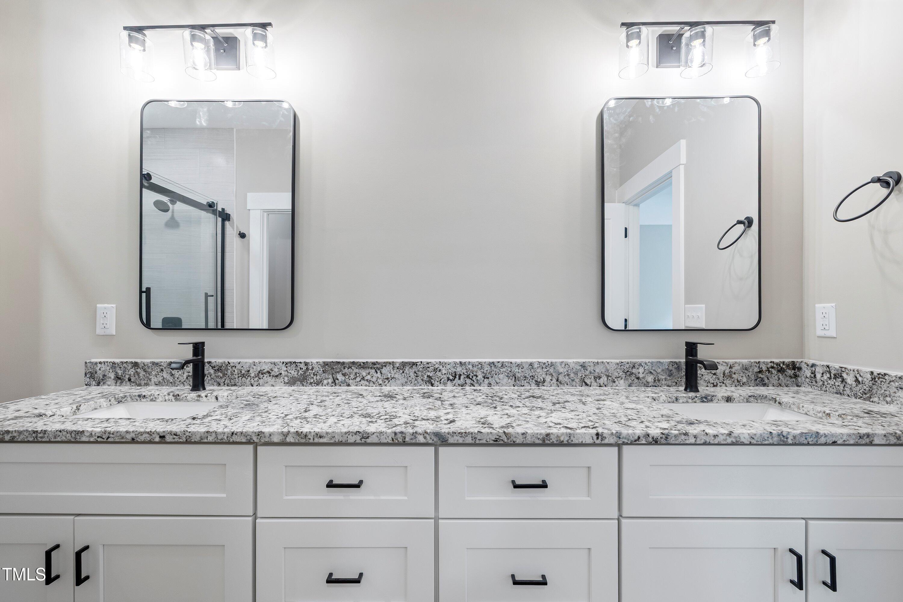 9293 Bear Run Lane Middlesex, NC 27557 - Photo 19 of 36 a bathroom with mirror sink and vanity