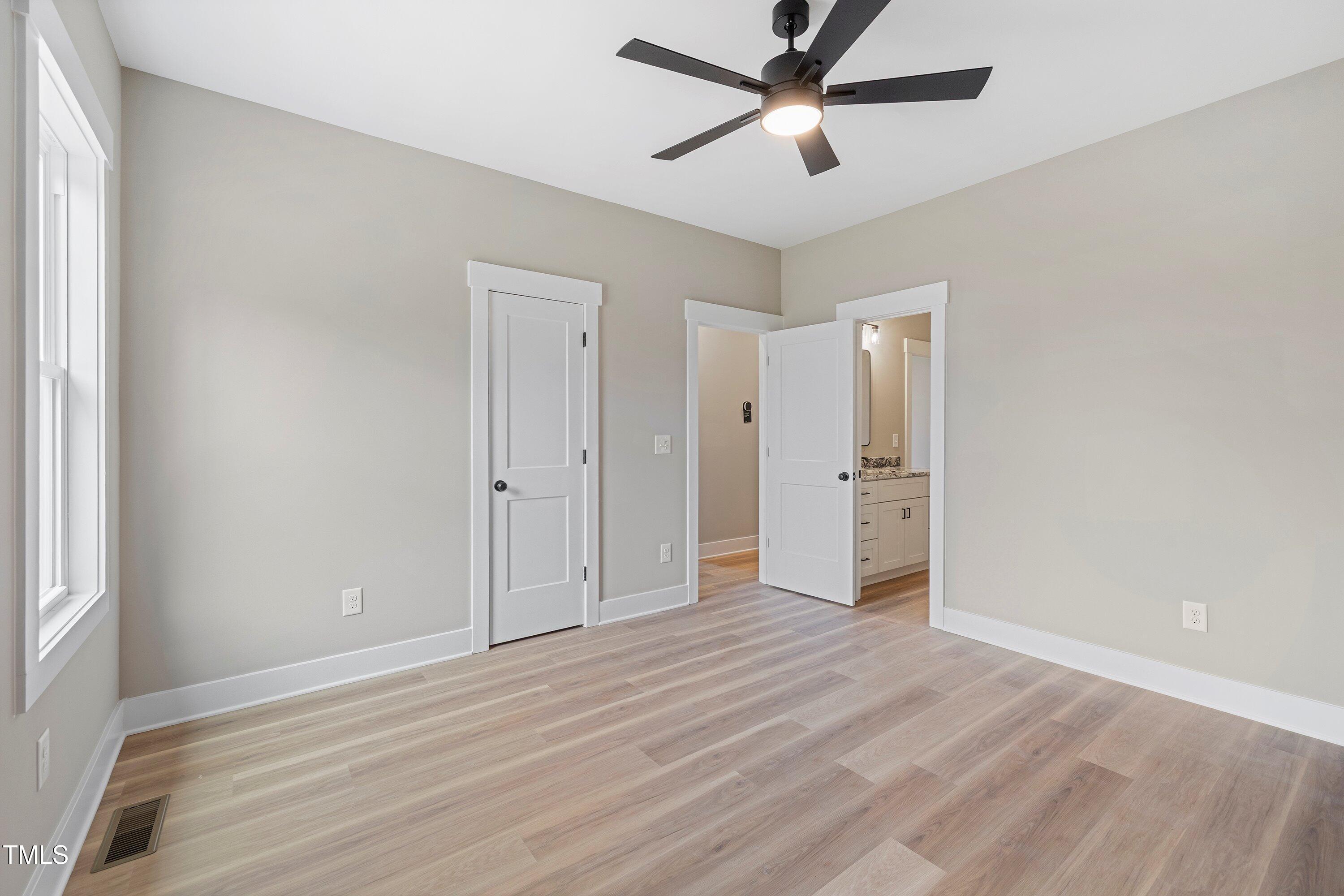 9293 Bear Run Lane Middlesex, NC 27557 - Photo 25 of 36 a view of empty room with wooden floor and ceiling fan