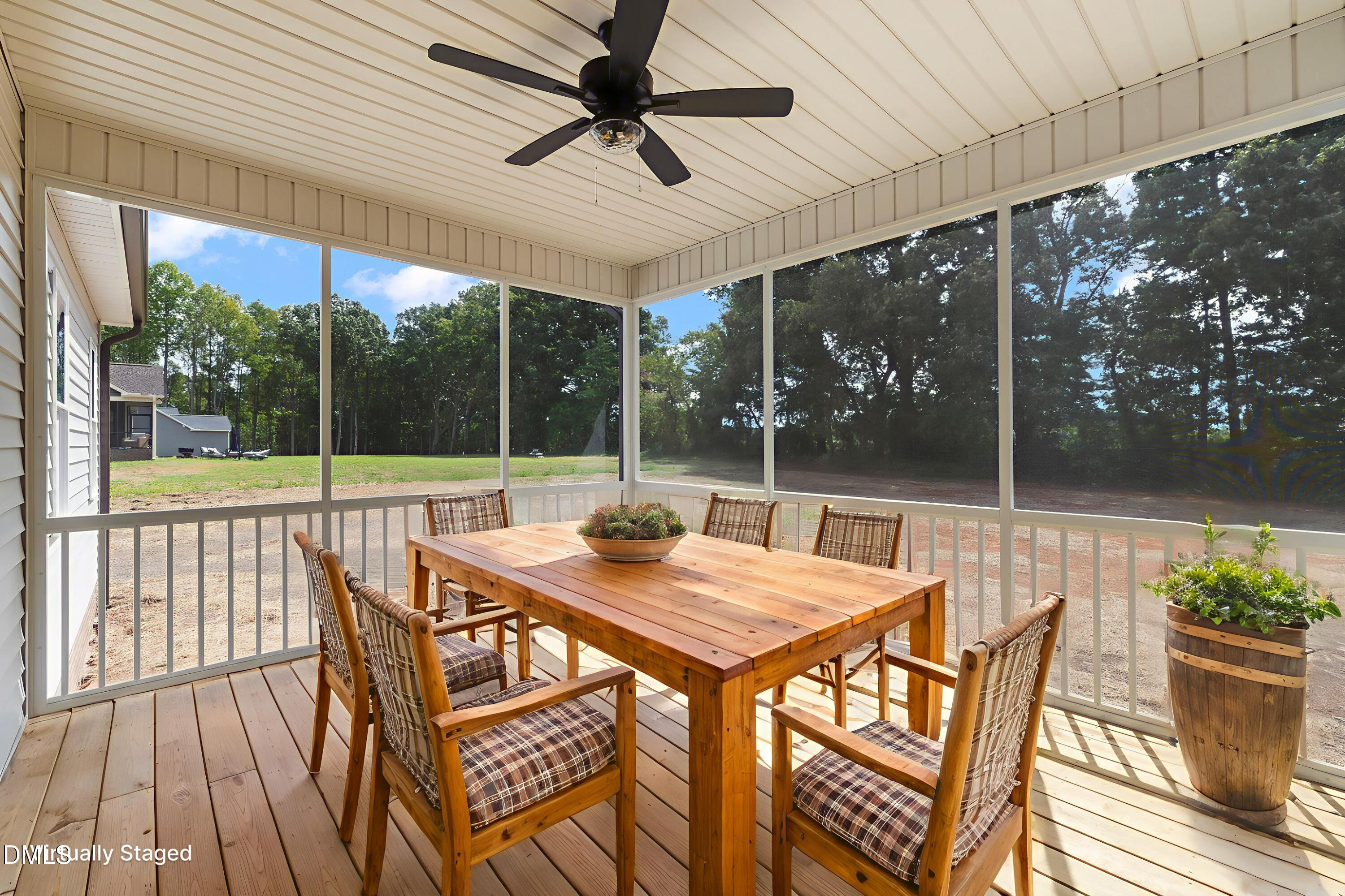 9293 Bear Run Lane Middlesex, NC 27557 - Photo 28 of 36 a view of a patio with a table chairs and a backyard