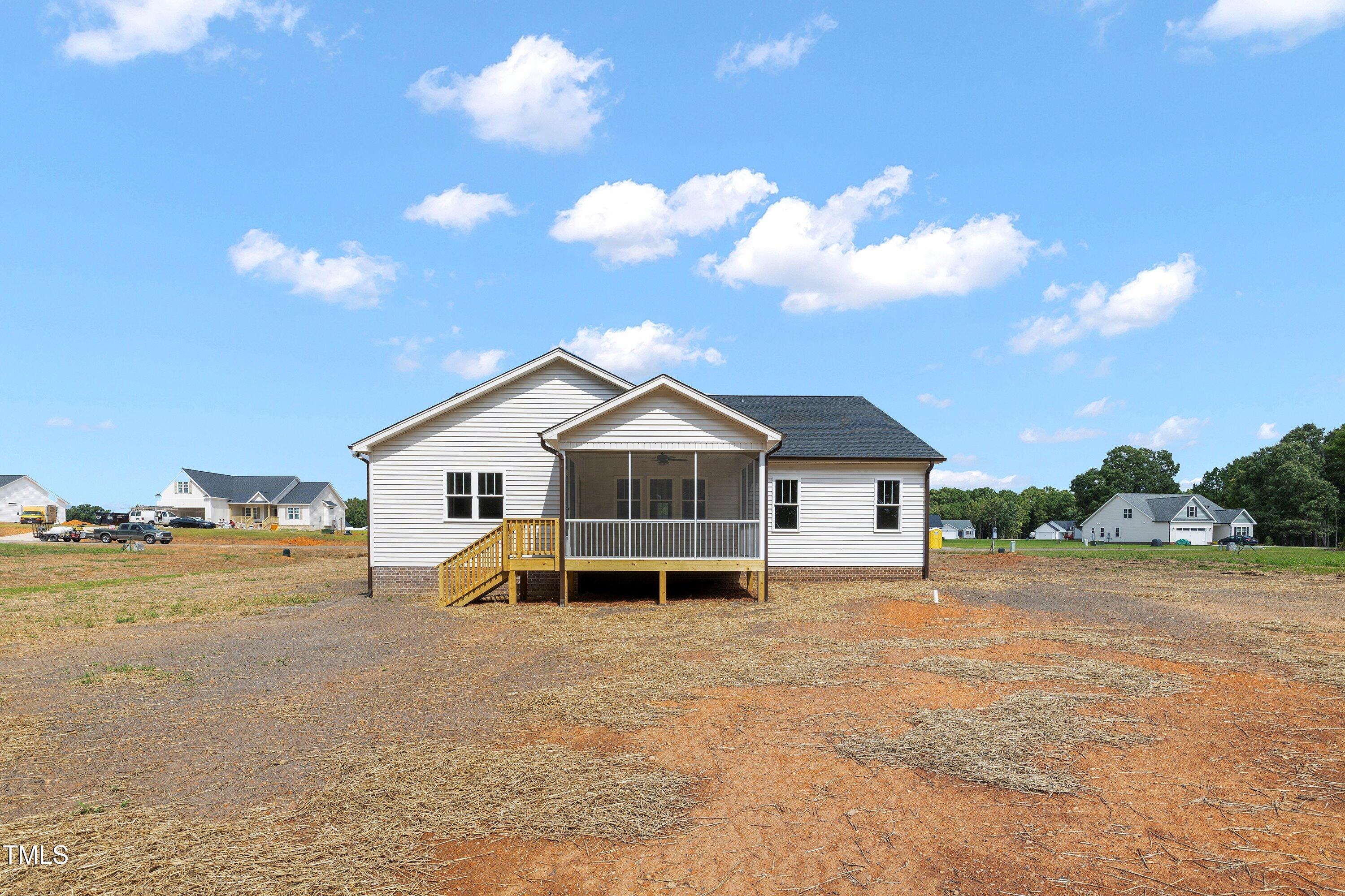 9293 Bear Run Lane Middlesex, NC 27557 - Photo 32 of 36 a view of a house with a yard and large trees