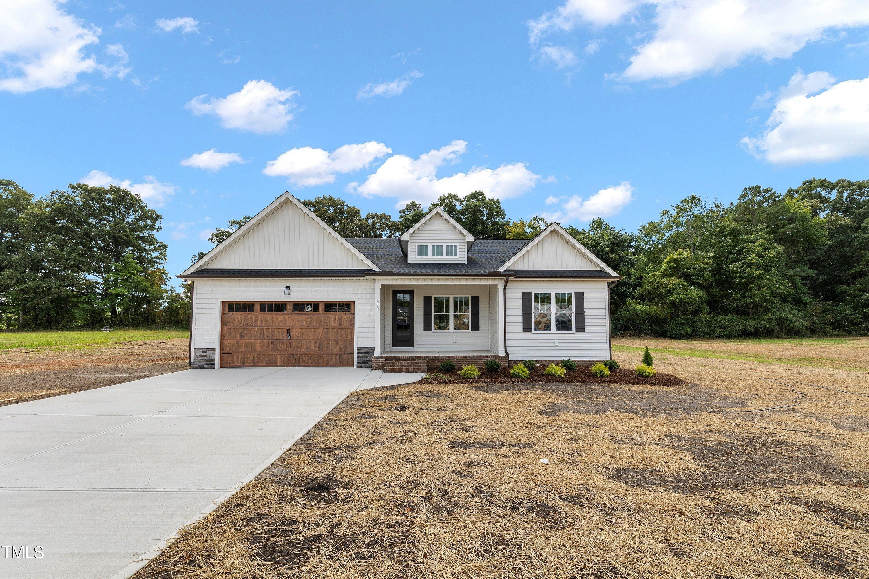 9293 Bear Run Lane Middlesex, NC 27557 - Photo 35 of 36 a house with trees in the background