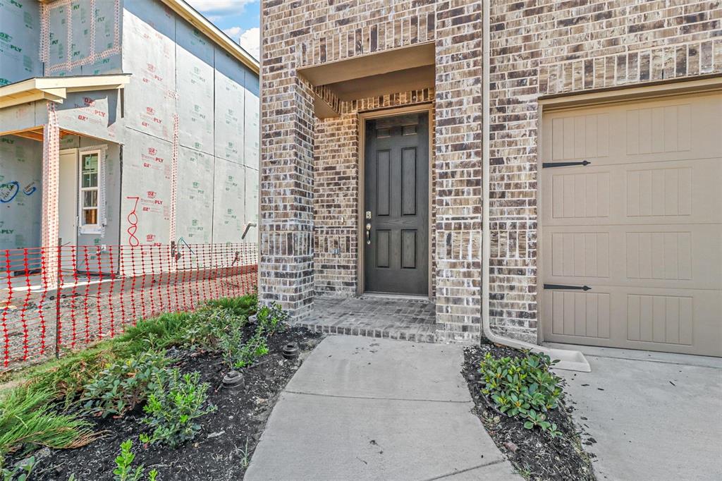704 Amenduni Lane Anna, TX 75409 - Photo 2 of 19 a front view of a house with a garden
