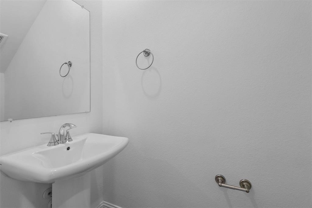 704 Amenduni Lane Anna, TX 75409 - Photo 8 of 19 a bathroom with a sink and mirror