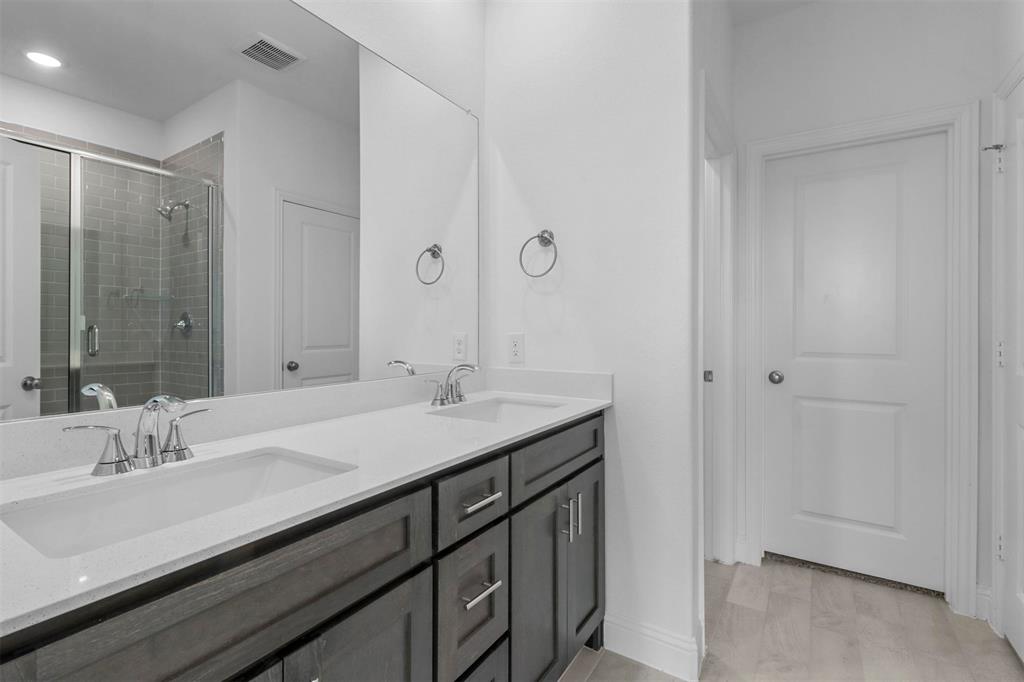 704 Amenduni Lane Anna, TX 75409 - Photo 10 of 19 a bathroom with a sink and a mirror