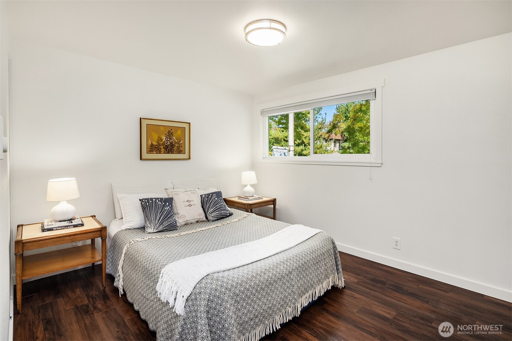 8701 35th Avenue Northeast, Unit 9 Seattle, WA 98115 - Photo 11 of 19 a bedroom with a bed and a window