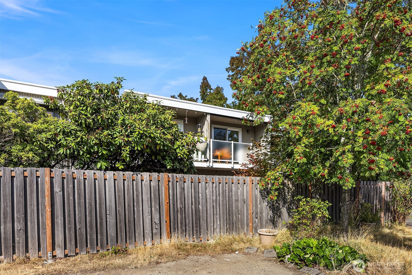 8701 35th Avenue Northeast, Unit 9 Seattle, WA 98115 - Photo 14 of 19 a view of a house with a small yard