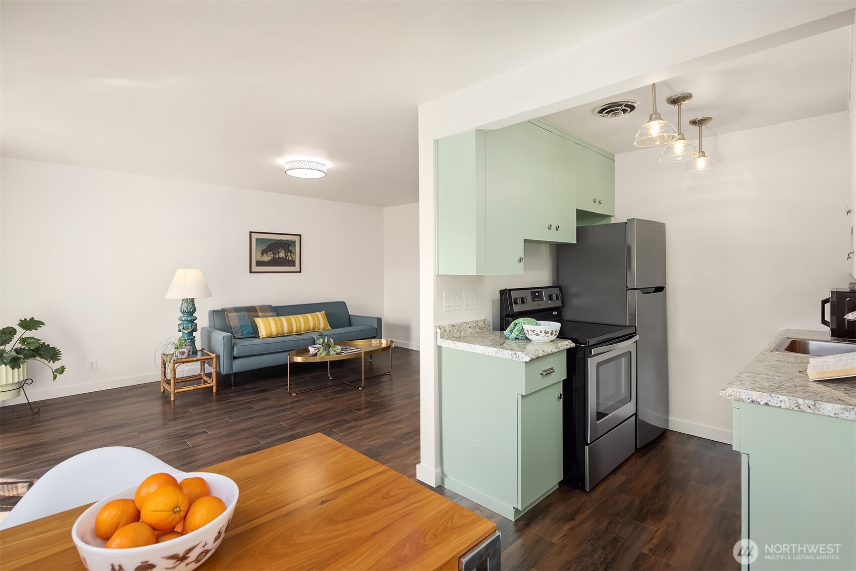 8701 35th Avenue Northeast, Unit 9 Seattle, WA 98115 - Photo 2 of 19 a living room with furniture and a table
