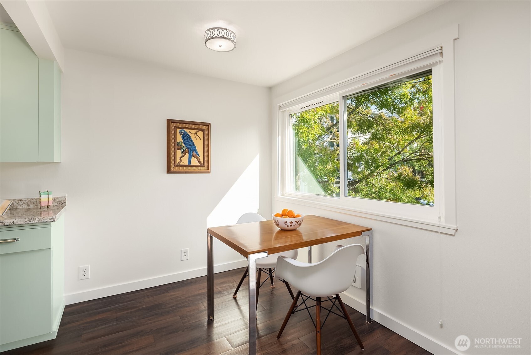 8701 35th Avenue Northeast, Unit 9 Seattle, WA 98115 - Photo 5 of 19 a view of a workspace with furniture and a window