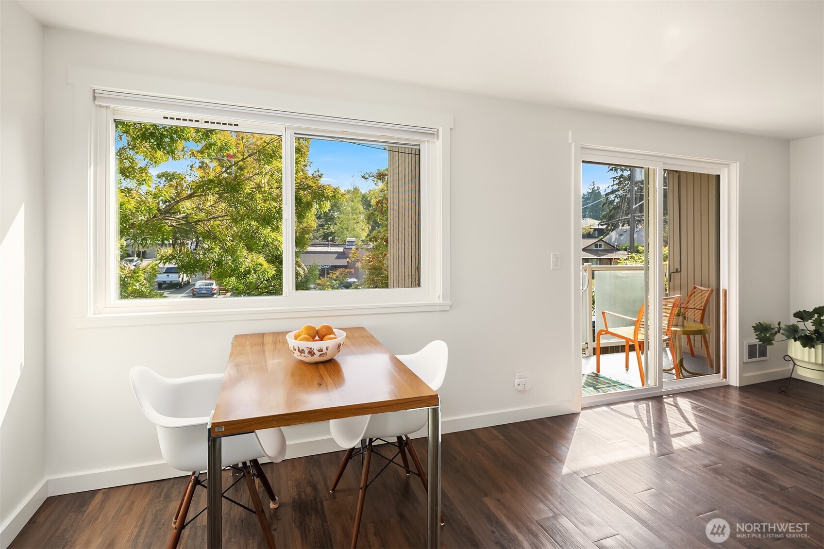 8701 35th Avenue Northeast, Unit 9 Seattle, WA 98115 - Photo 6 of 19 a view of a dining room with furniture and wooden floor