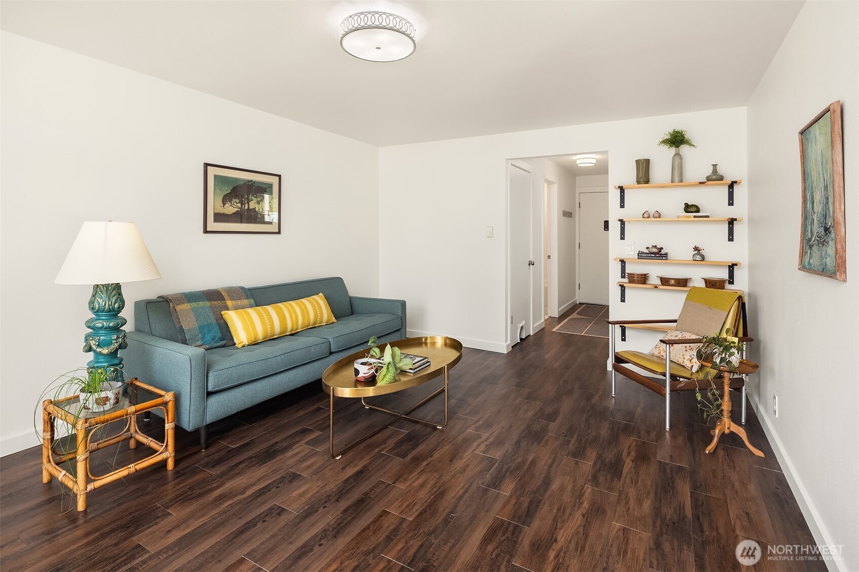 8701 35th Avenue Northeast, Unit 9 Seattle, WA 98115 - Photo 7 of 19 a living room with furniture and wooden floor