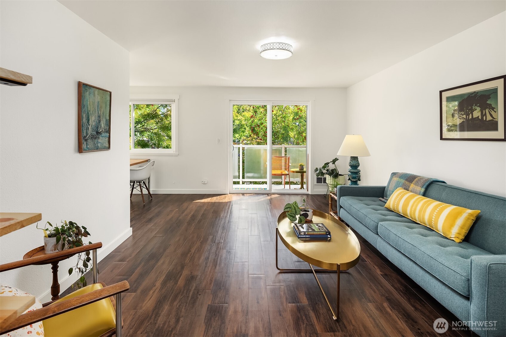 8701 35th Avenue Northeast, Unit 9 Seattle, WA 98115 - Photo 9 of 19 a living room with furniture and a wooden floor