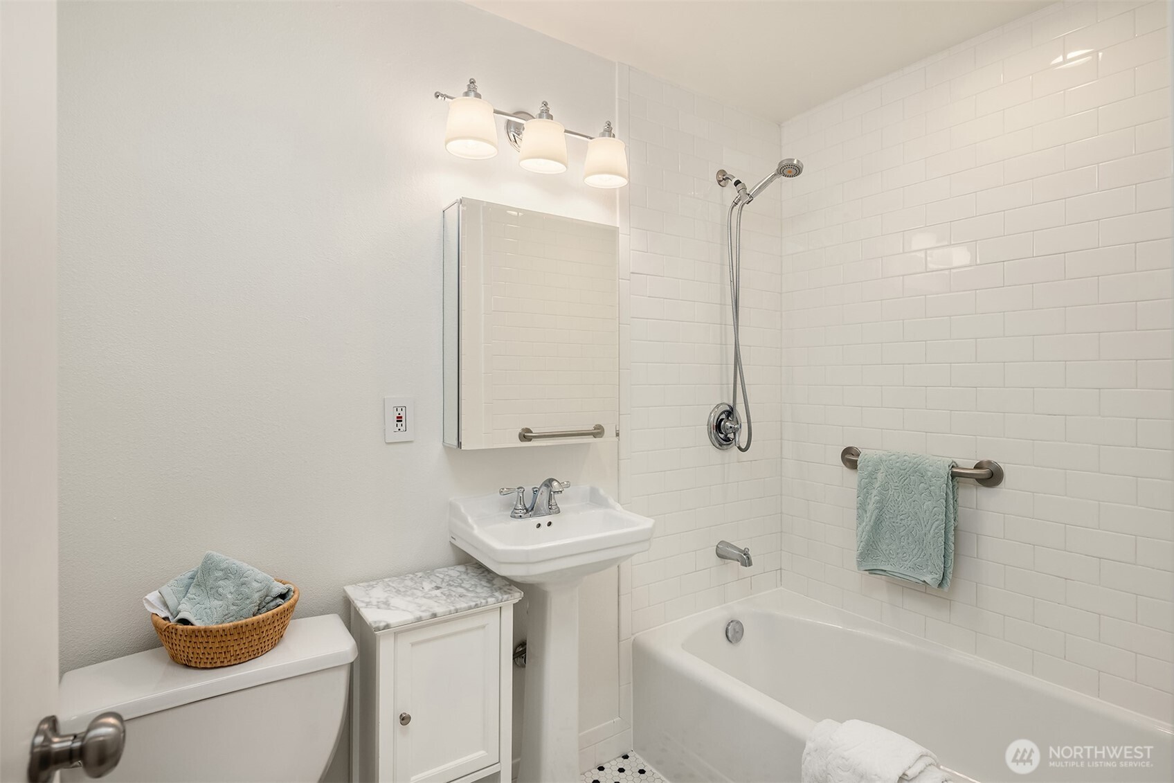 8701 35th Avenue Northeast, Unit 9 Seattle, WA 98115 - Photo 10 of 19 a bathroom with a sink and a bathtub