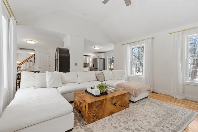 a living room with furniture and a rug