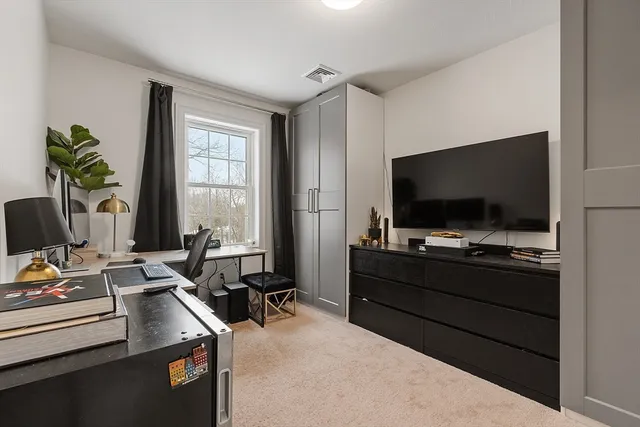 a room with furniture and flat screen tv