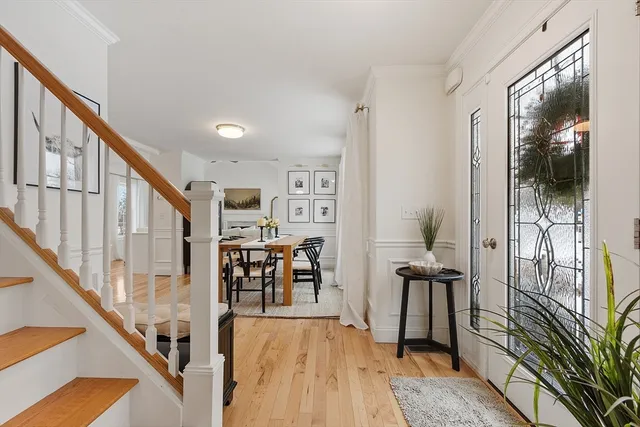 a view of a hallway with furniture and entryway