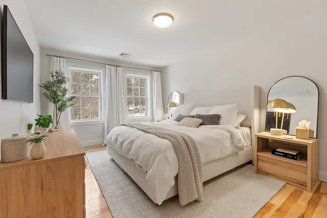 a bedroom with a bed and window