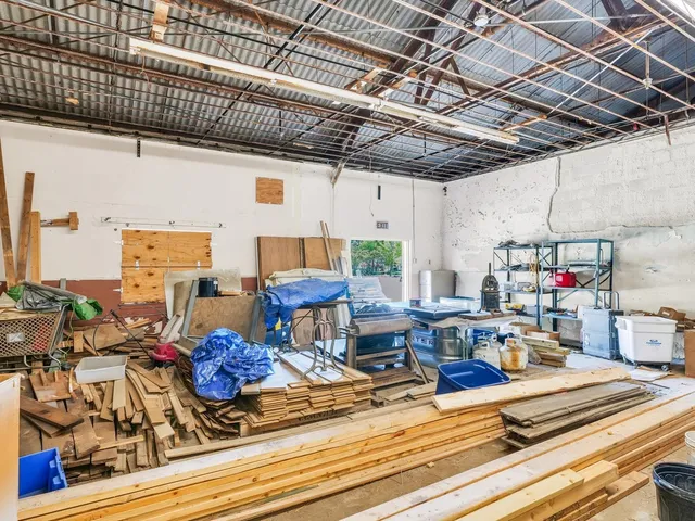 a kitchen with lots of counter top space and stainless steel appliances