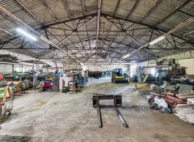 a view of parking garage with cars