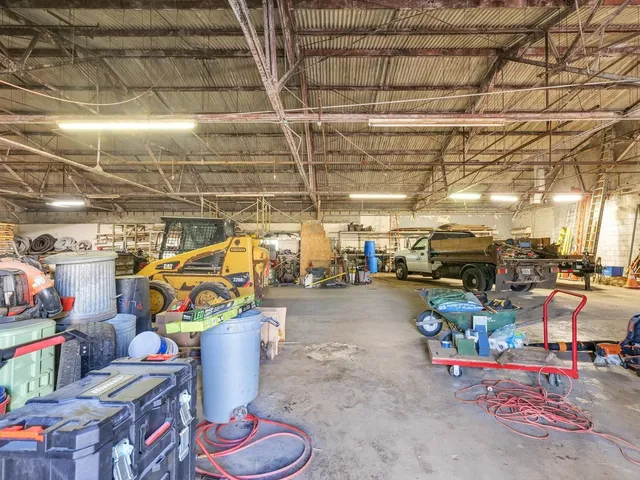a view of a yard with cars