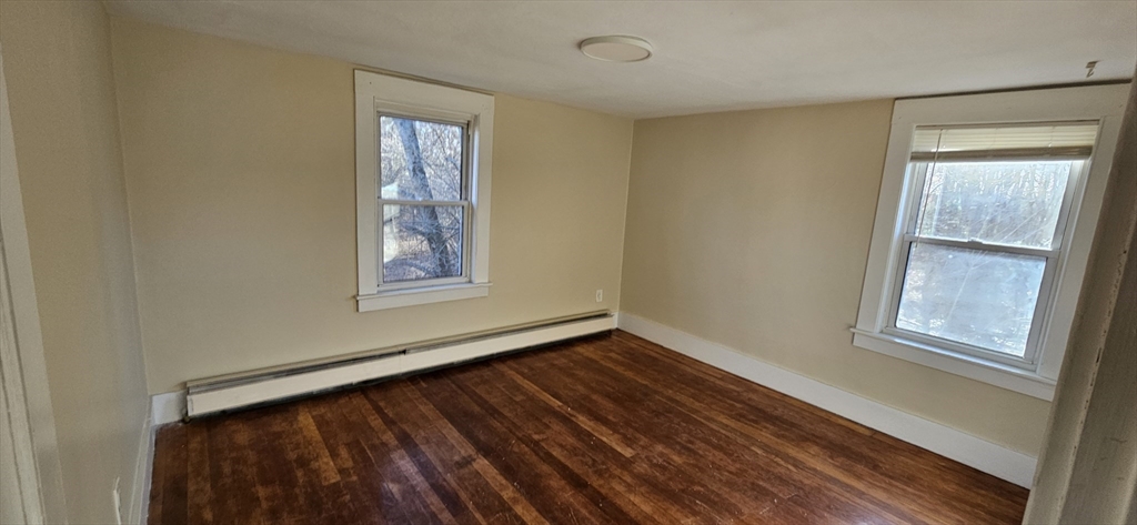 378 Boston Road Monson, MA 01069 - Photo 12 of 22 a view of an empty room with wooden floor and a window