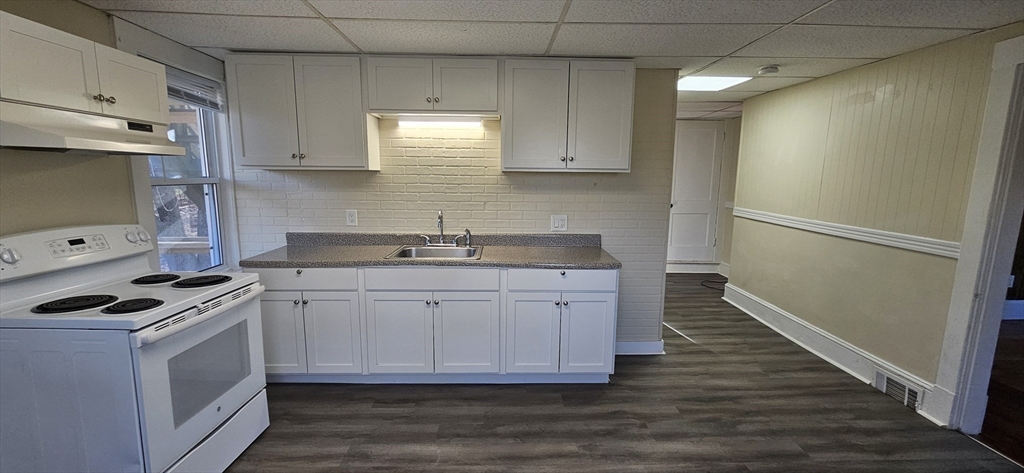 378 Boston Road Monson, MA 01069 - Photo 15 of 22 a kitchen with granite countertop a sink cabinets and stainless steel appliances