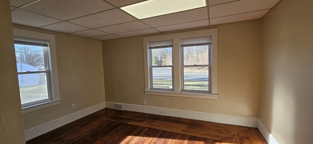 378 Boston Road Monson, MA 01069 - Photo 21 of 22 a view of an empty room with wooden floor and a window
