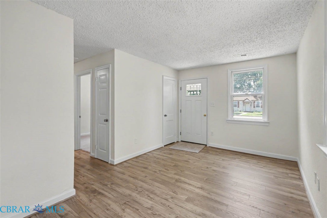 914 Ridgeway Avenue Hampton, VA 23661 - Photo 11 of 33 a view of an empty room with wooden floor