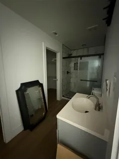 a bathroom with a sink and mirror