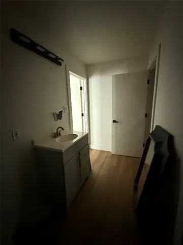 a bathroom with a sink and mirror
