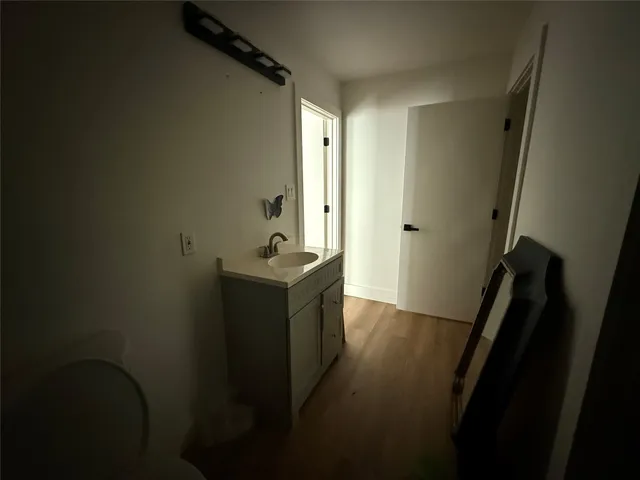 a bathroom with a sink a mirror and a toilet