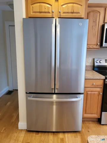 a view of a refrigerator in kitchen