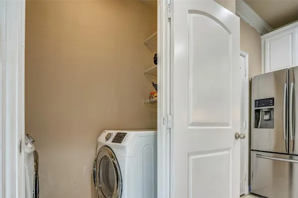 a view of storage and utility room with washer and dryer