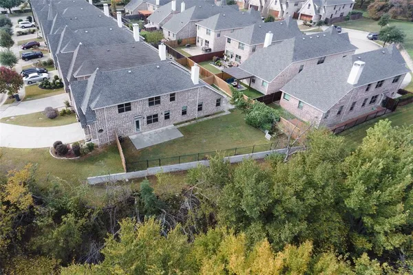 an aerial view of house with yard