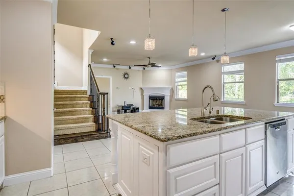 a kitchen with a sink a counter space and appliances