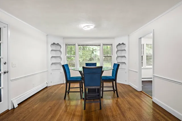 a dining room with furniture window wooden floor