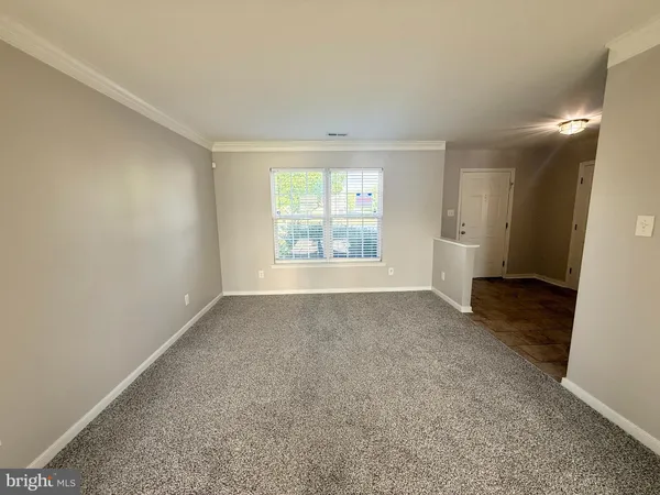 a view of empty room with windows