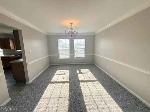 a kitchen with stainless steel appliances granite countertop a stove a sink a refrigerator a microwave and cabinets