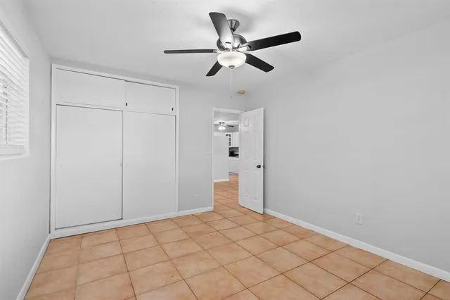 a view of an empty room and wooden floor